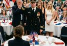 I was sitting alone at the far end of the room while everyone celebrated my sister like she was the only one who mattered. Then the doors opened, and her Navy husband stepped inside, swept his eyes across the crowd, and walked straight toward me. He stopped in front of my chair, lifted his hand in a crisp salute, and said, “Ma’am.” The entire room went still, and for the first time all night, my sister’s smile finally broke.